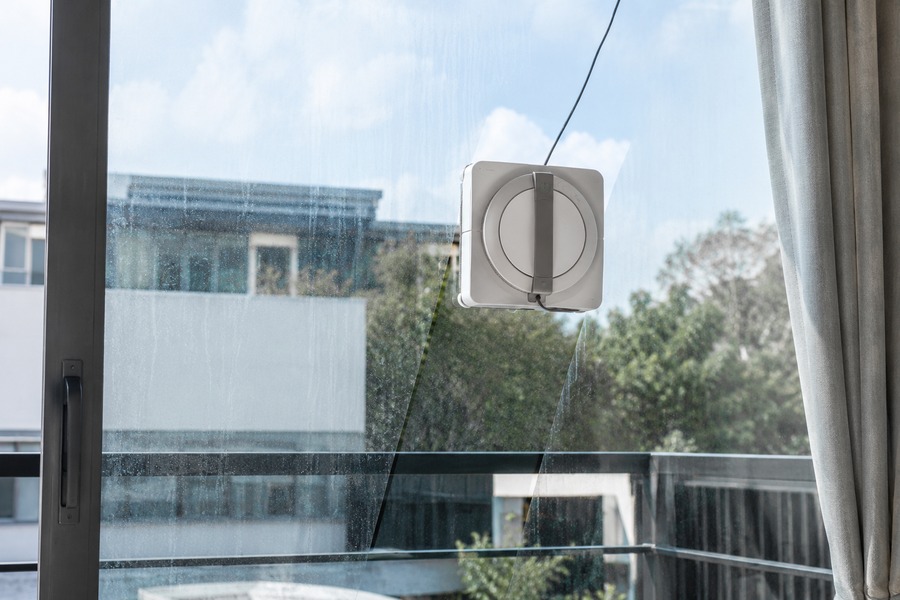 Window cleaning robot in action on a glass window